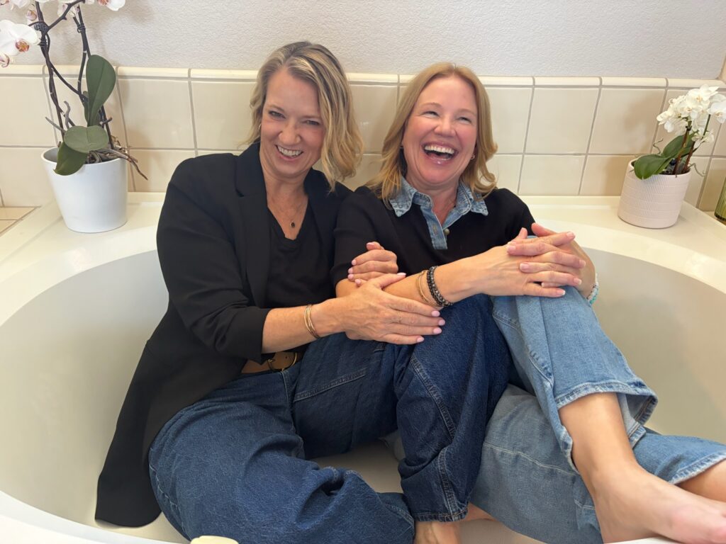 Jennifer Adams and Shannon laughing together for The Chapter We’re In podcast